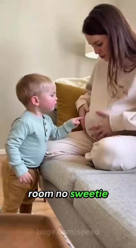 Young boy points at pregnant mom's belly and asks if she ate the baby.