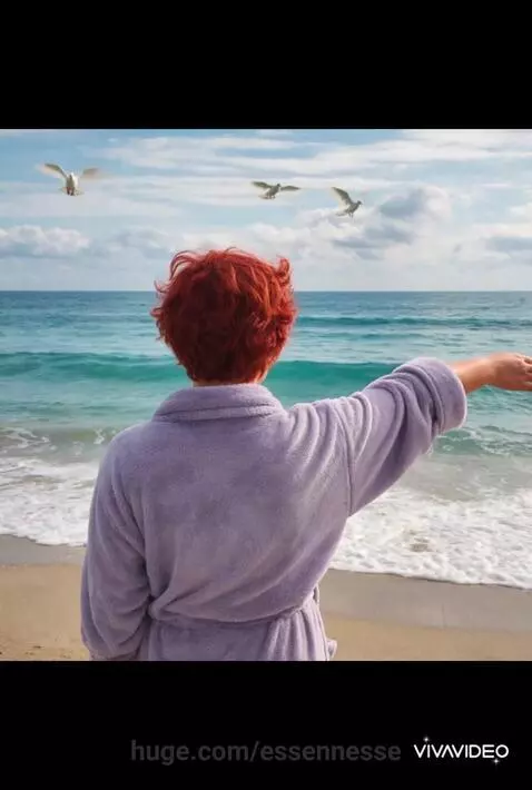 Young woman with red curly hair in a poppy field, releasing a dove, symbolizing freedom and self-discovery.
