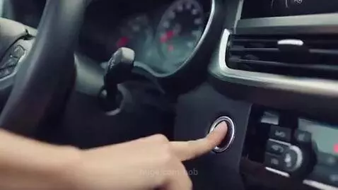 Woman pouring olive oil into a car engine, mechanic reacts in disbelief.