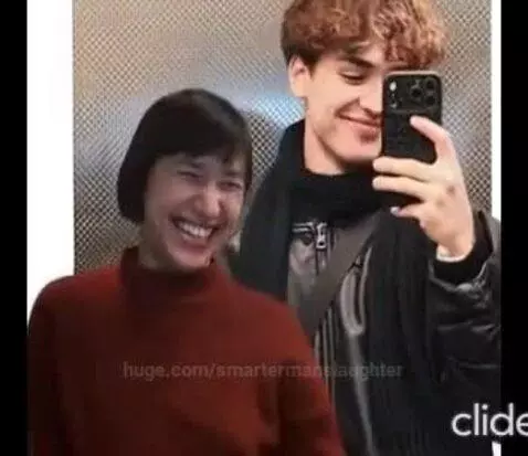 A couple taking selfies in an elevator, with funny face swap filters applied.