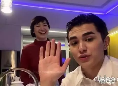 Couple embracing and kissing in a kitchen with blue and yellow lighting, featuring black and white transitions.