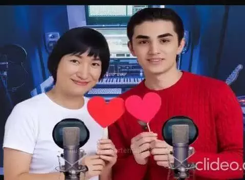 Amirchik and Nazgul singing a love song in a studio, holding heart cutouts with animated effects.