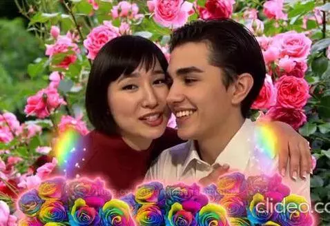 Couple embracing in a rose garden, holding rainbow roses, with animated hearts and petals.
