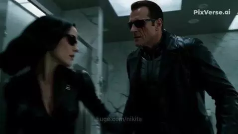 Woman in black suit punches man through wall in a destroyed bathroom, revealing his cybernetic eye.