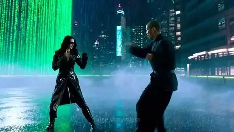 Woman in black outfit performs a flip on a man during a fight in a futuristic city with green digital rain.