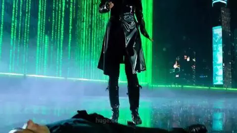 Woman in black outfit performs a flip on a man during a fight in a futuristic city with green digital rain.