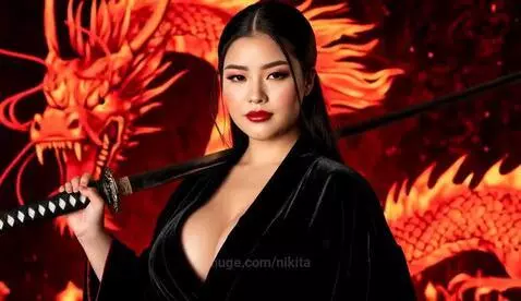 Woman with dark hair and katana, serious expression, posing with a fiery red dragon in a smoky, dark background.