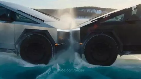 Two Tesla Cybertrucks colliding head-on on a frozen, icy surface, creating a large splash of ice and water.