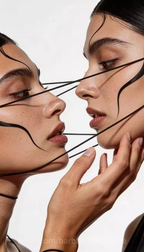 Artistic portrait of a woman's face and body intertwined with white cords and black strings, conveying connection.