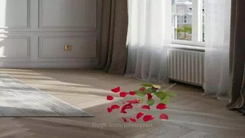 A single red rose with scattered petals lying on a wooden floor in a well-lit room.