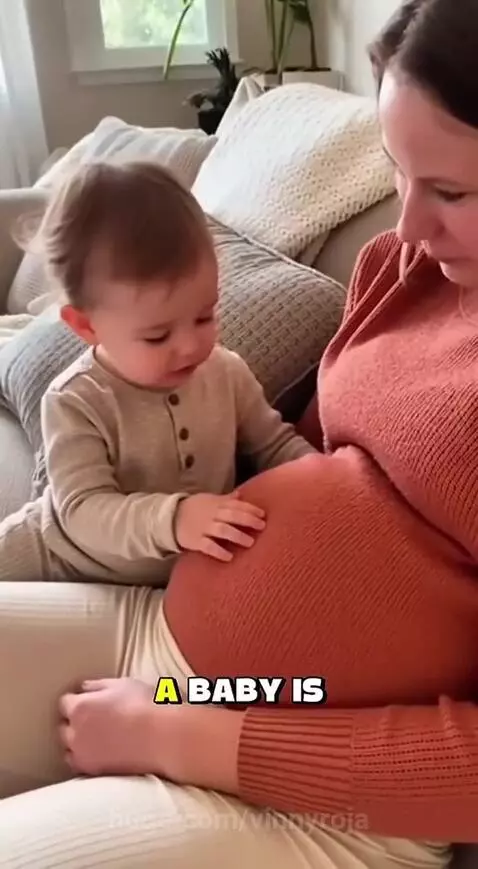 A young child touches a pregnant woman's belly, looking confused and asking why she ate the baby.
