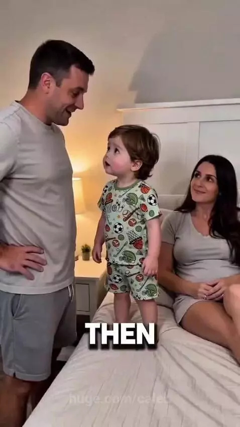 Child in pajamas on a bed, confidently telling his dad to sleep with grandma.