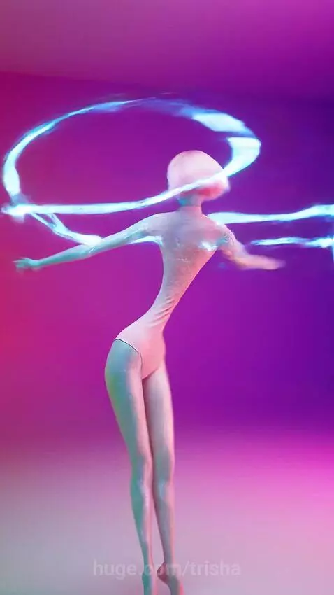 Surreal animation featuring a pink cat with tentacles and spider legs in a melting environment, vibrant neon colors.