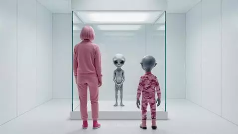 Woman with pink hair and an alien in a pink tracksuit standing in front of a UFO at Area 51.