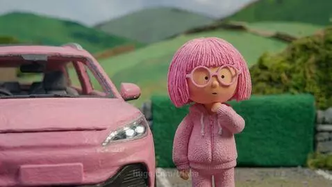 Stop-motion claymation of a pink electric car and a red classic sports car racing, with a police officer approaching.