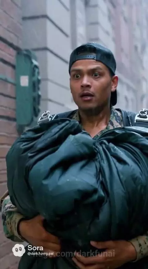 Man in military camouflage parachuting into a rainy city street, landing near a building.