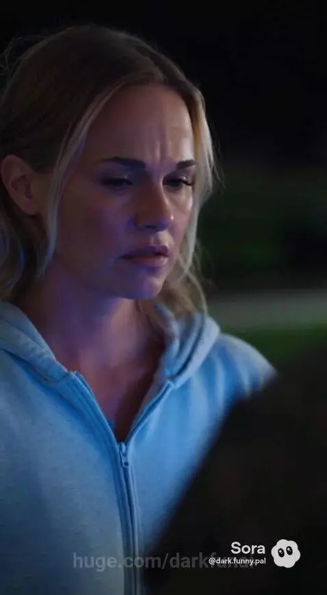 Woman in blue hoodie questioned by military officer about a man who appeared from a purple portal.