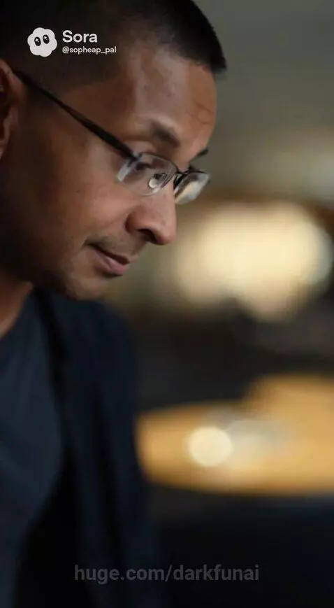 Man and woman holding hands in a cafe, discussing being 'archived' and a 'fake' version.