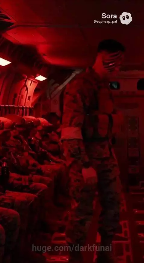 Military personnel with face paint running towards and boarding Ospreys at dusk, preparing for a mission.