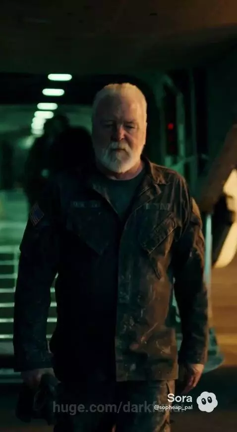 Military Osprey aircraft landing on USS Tripoli deck at night, with sailors and marines saluting.