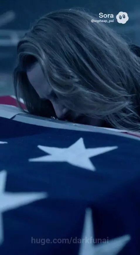 A grieving widow in a military ceremony watches as soldiers carry a flag-draped coffin.