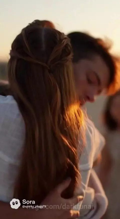 Soldier holding his newborn baby, reunited with his wife on their porch at dusk.