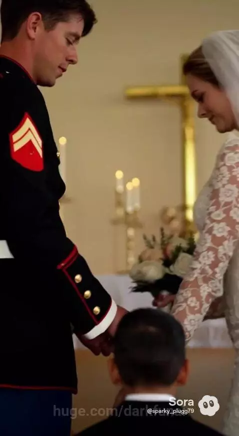 Marine groom in uniform and bride in white gown exchange vows, with ring bearer nearby, bathed in sunlight.