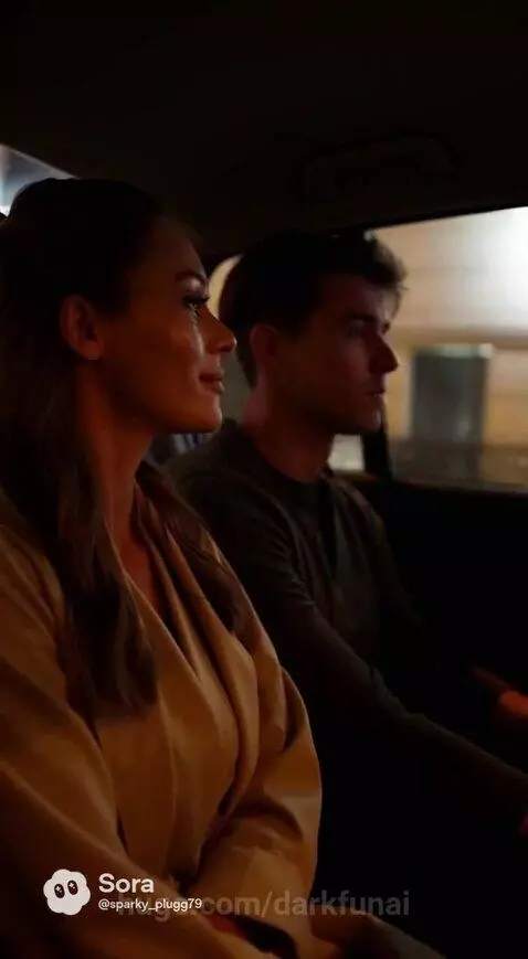 Couple enjoying Eiffel Tower view from balcony on their Paris honeymoon.