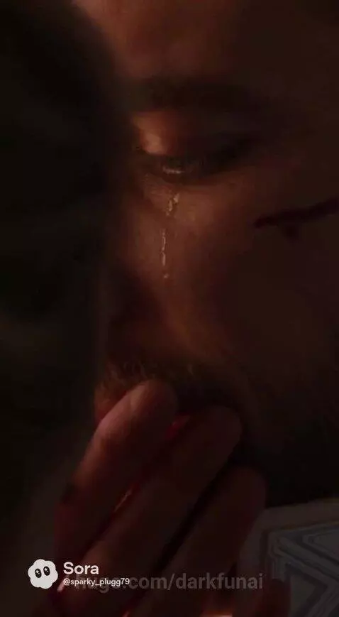 Couple embracing in a magical futuristic landscape with glowing trees and geometric paths.