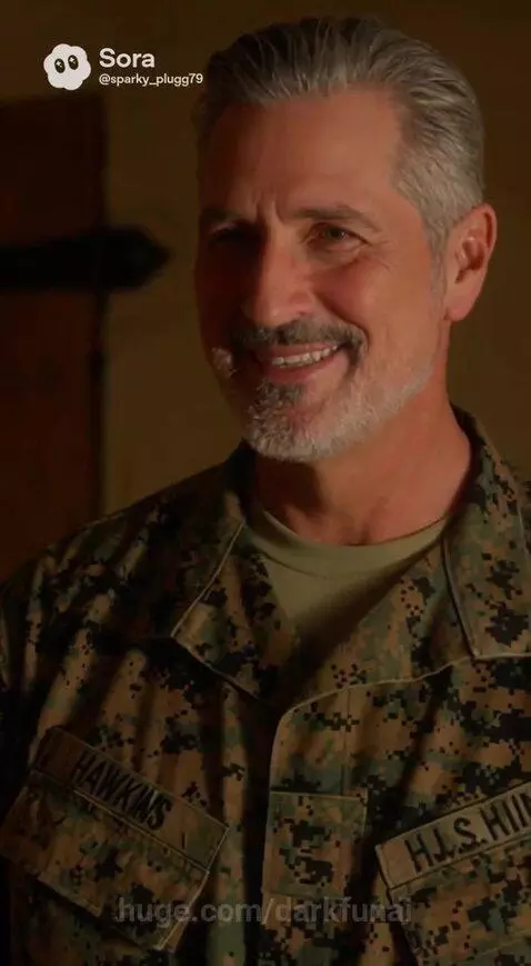 Woman in maroon dress holding infant, with a man in military uniform looking out at a futuristic cityscape.