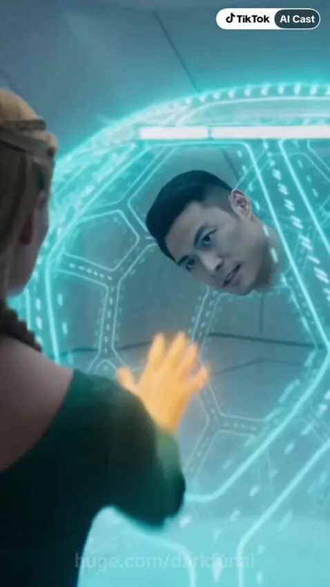 Woman in green dress with golden headpiece uses powers on a man in a futuristic white room.