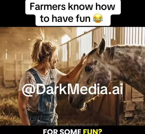 A farmer with dirt on her clothes smiles and pets a large white horse in a barn, sharing a playful moment.
