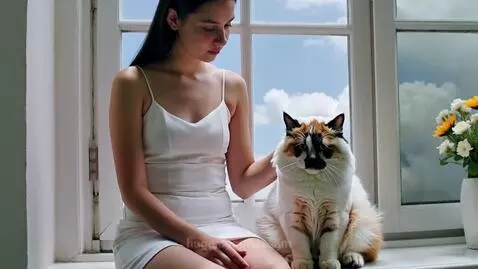 Girl with cat by hassam