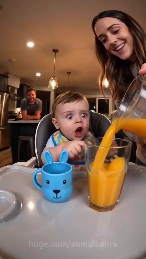 Baby in high chair looking surprised and sad as orange juice is poured, then happy drinking from a bunny cup.