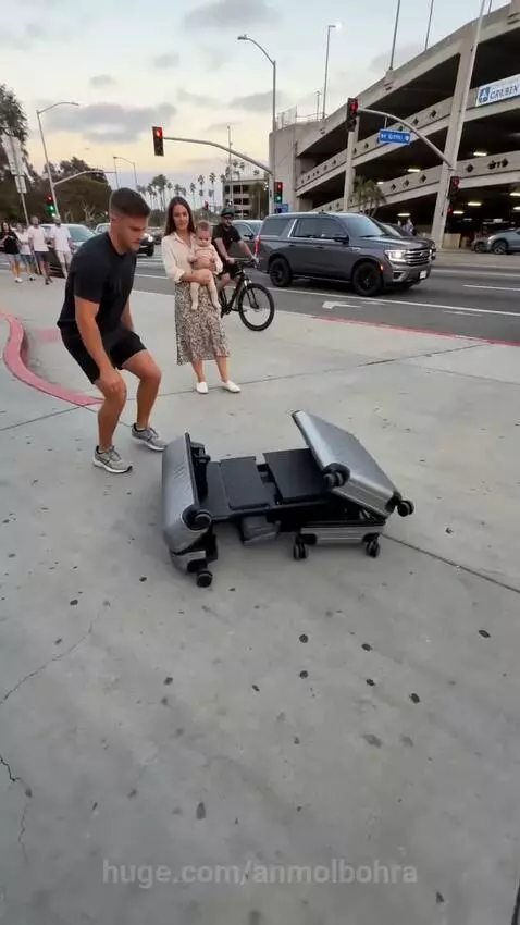 Man pulls a suitcase that transforms into a small electric car with two seats. A couple is seen inside.