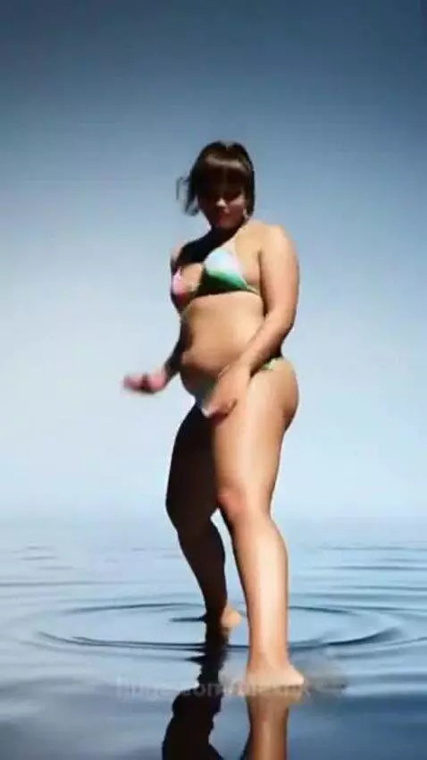 A girl in a bikini dancing on the water by alexnk