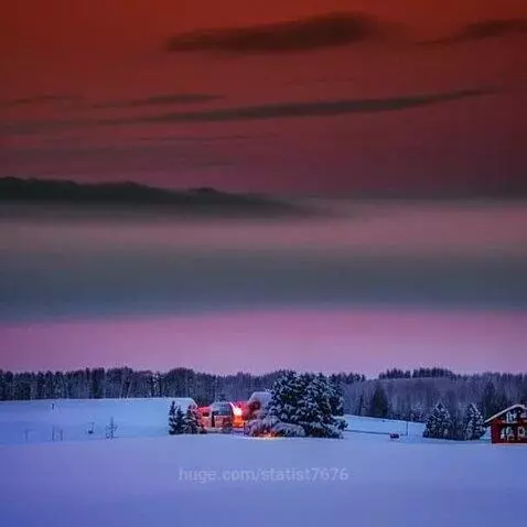 Serene winter village at dusk with snow-covered trees, a cozy building with warm lights, and a colorful sky.