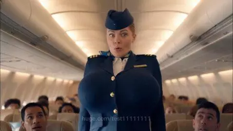 Airline stewardess in an airplane aisle looking surprised with an unnaturally enlarged chest.