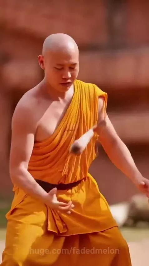 A gorilla roaring comically after a monk breaks a stick, with laughing monks in the background.