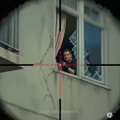 Sniper scope view of an urban street at night, focusing on an apartment building and an alleyway.