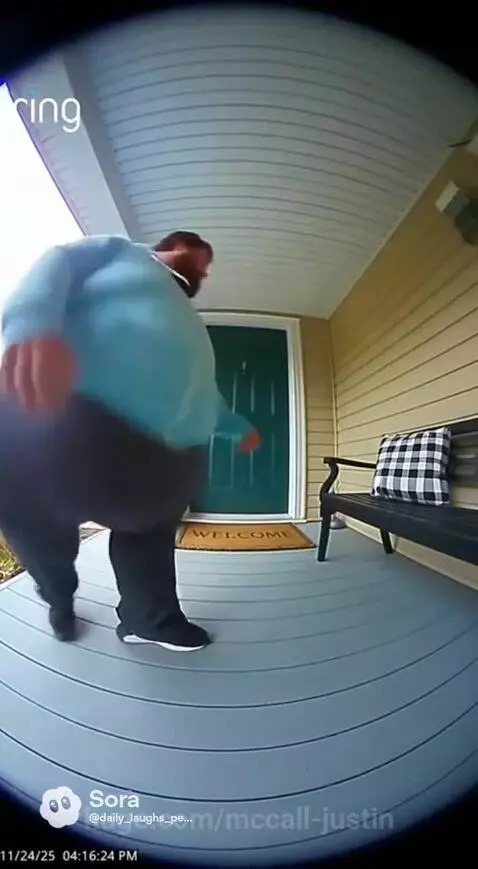 Person forcefully pushing a couch out of a doorway, creating a large dust cloud upon impact.