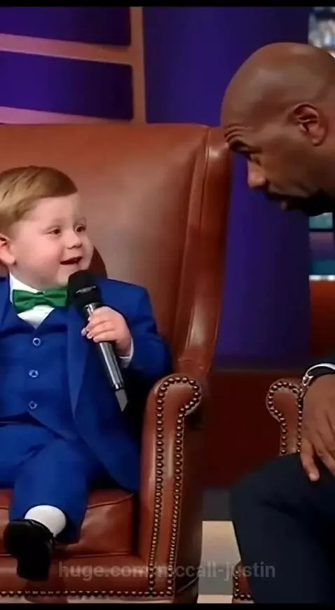 Young boy in a suit tells Steve Harvey that his dad makes his mom mad.