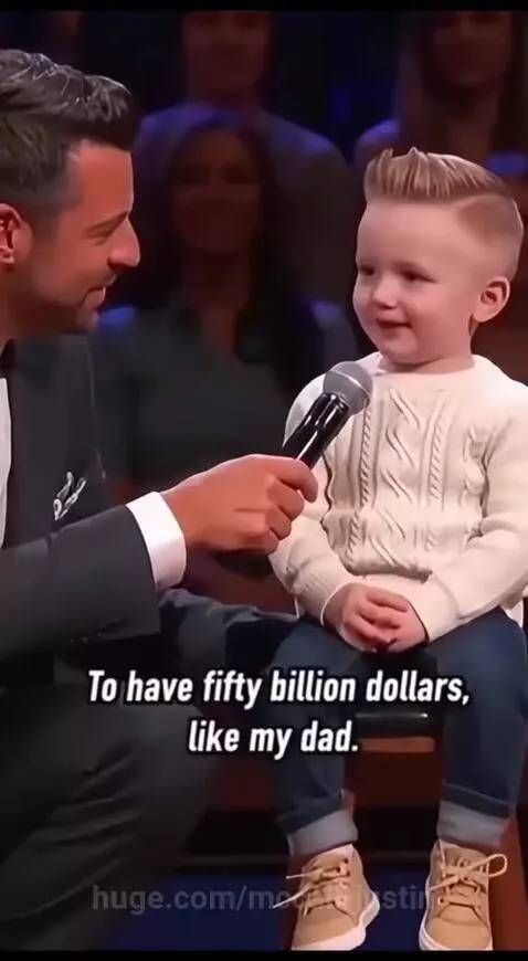 Young boy confidently states his dream is to have fifty billion dollars, like his dad.