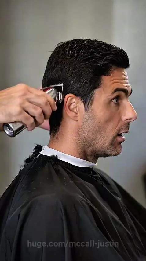 Mikel Arteta crying with a 'Z' shaved into his bald head, while Pep Guardiola laughs.