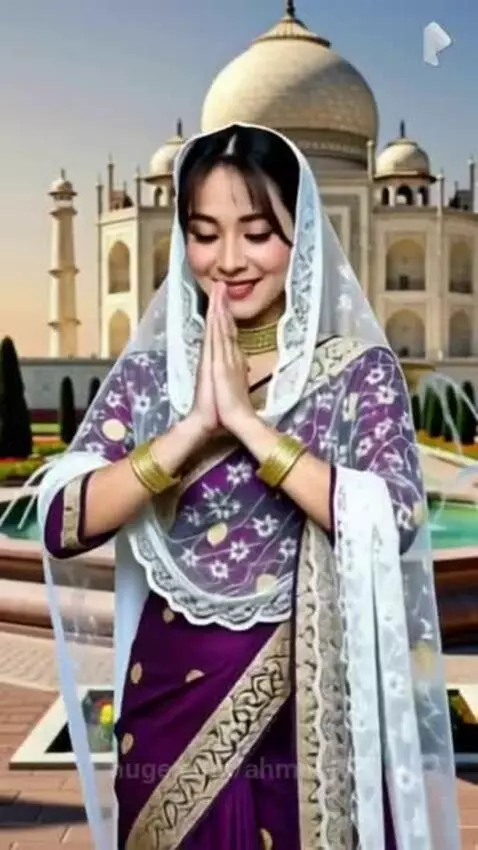Woman in traditional Indian saree and veil performing Namaste gesture at the Taj Mahal with fountains and gardens.