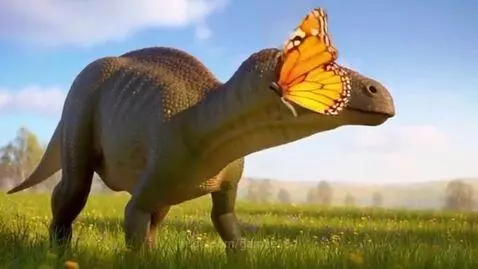 A large green dinosaur in a field with a butterfly perched on its snout.