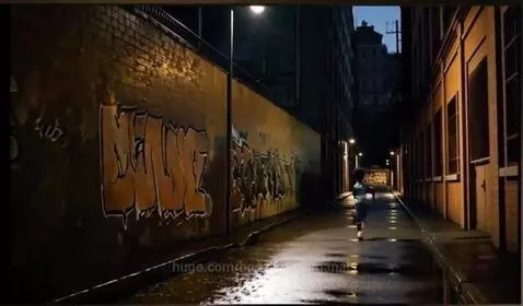 Police officer in a graffiti alleyway drawing his handgun and pursuing a fleeing suspect.