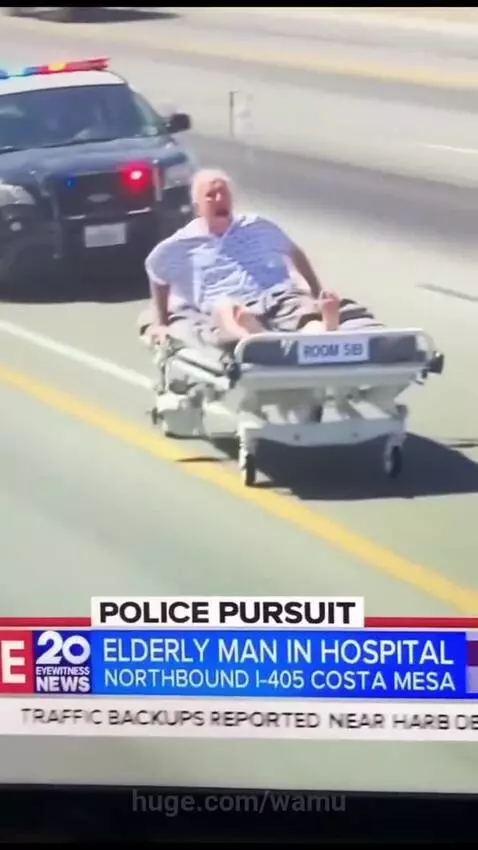 Elderly man in hospital gown on a hospital bed with IV pole being chased by police cars on a highway.