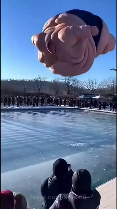 Extremely obese man in black swimsuit on diving board above frozen pool, about to jump.