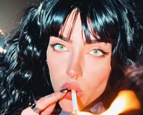 Montage of Iranian women protesting, burning images, facing police, with fires and smoke in the background.